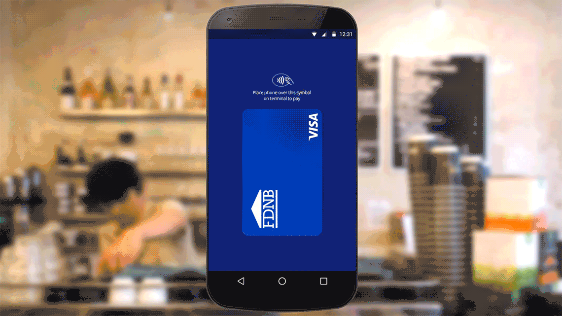 multi-sensory-branding-1140x641 Contactless symbol with instructions and FDNB Visa logo displayed on smart phone superimposed over background of a coffee bar counter.